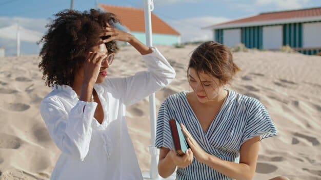 A person generously applying sunscreen to their back with the help of another person. The focus is on the even coverage and the act of ensuring no area is missed.