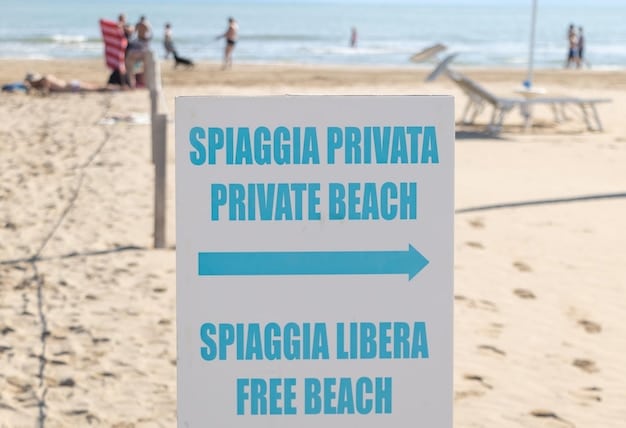 A close-up shot of a sign posted on a beach outlining specific regulations for beach bonfires, including permissible hours, container requirements, and prohibited materials. The sign is clear and informative, emphasizing the importance of reading and following the rules.