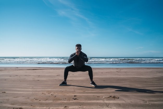 An action shot of someone doing lunges on the beach, with the ocean in the background and the sun shining.