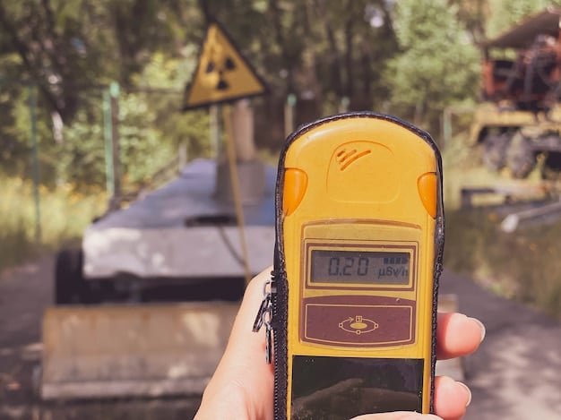 A close-up of a weather radio displaying a severe thunderstorm warning. The radio is placed on a picnic table at a beach campsite.