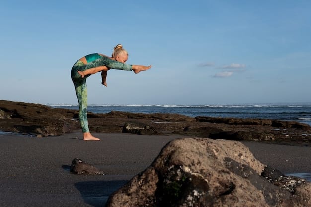 A surfer is demonstrated a high lunge yoga pose on the beach, with the ocean in the background. The focus is on the alignment of the front knee over the ankle and the back leg extended straight.
