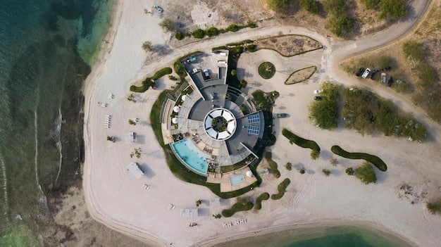 Montage Laguna Beach resort from an aerial view, showcasing its stunning oceanfront location, lush landscaping, and the helipad situated discreetly on the property.