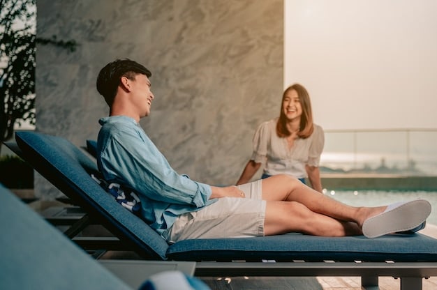 A therapist talking to a client in the relaxation area of a luxury beach resort spa. They are discussing the client's preferences and needs for their spa treatment. The relaxation area is decorated with comfortable chairs, soft lighting, and calming artwork.