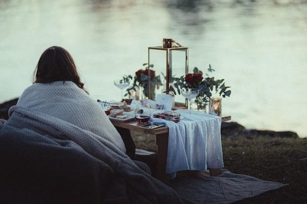 A beautifully set table on a private beach, with candles, flowers, and fine china. A waiter is serving a couple a gourmet meal, and the sunset is providing a stunning backdrop.