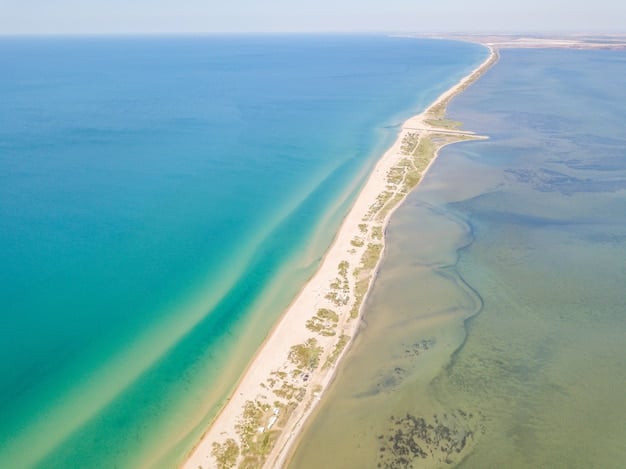 Aerial view of Gulf Shores, Alabama, showcasing its white sand beaches, clear turquoise water, and the vibrant coastline.