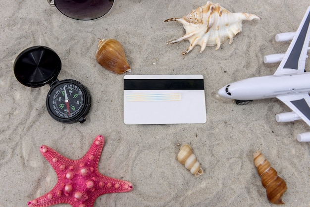 A close-up shot of various credit cards with travel-related imagery, such as airplanes, beaches, and hotel logos. The focus is on brand names and card designs.