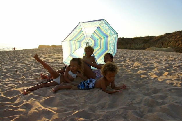 Friends building a sandcastle on a beach in South Padre Island, Texas, under a sunny sky, with beach umbrellas and the ocean in the background.
