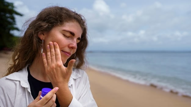 A woman with medium skin tone applying sunscreen to her arm on a sunny beach, demonstrating proper sun protection.
