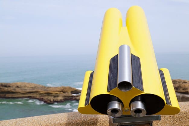 A detailed shot of a surfboard fin installation, possibly showing a modern fin box system, with a background of ocean waves, highlighting the evolution of surfboard technology.