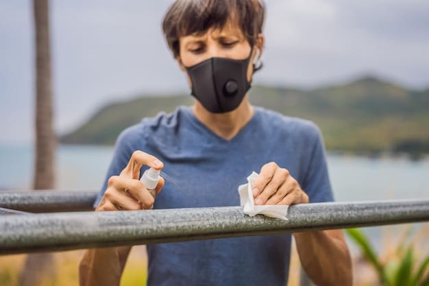 A person gently cleaning a snorkel mask with a soft cloth and a bottle of mild soap, illustrating careful maintenance.