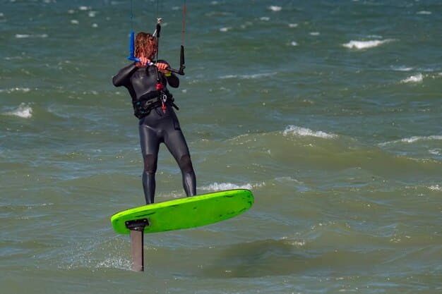 A windsurfer with feet in footstraps, leaning back with the body over the water, sail fully powered, demonstrating advanced control and speed.