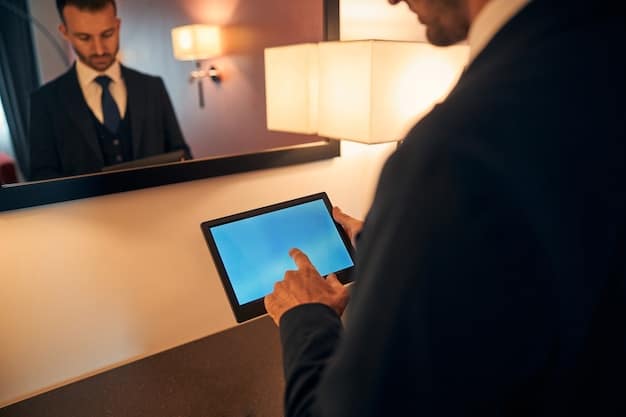 A guest interacting with a futuristic touchscreen in a resort suite, displaying options for room service, entertainment, and local activities, with the ocean visible through large windows in the background.