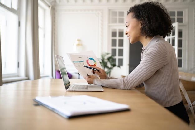 A person sitting at a desk with a laptop open to a spreadsheet, reviewing financial data and receipts from a past trip, with a focus on budgeting and expense tracking. A travel map and small souvenirs are in the background, suggesting a post-travel analysis.