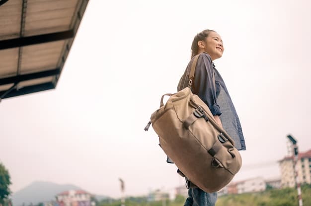 A traveler easily walking through an airport with just a compact backpack and a small carry-on bag, smiling, symbolizing the ease and freedom of light travel.